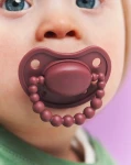 Smoczek pozycjonujący - Moroccan Pink / LUU Kids