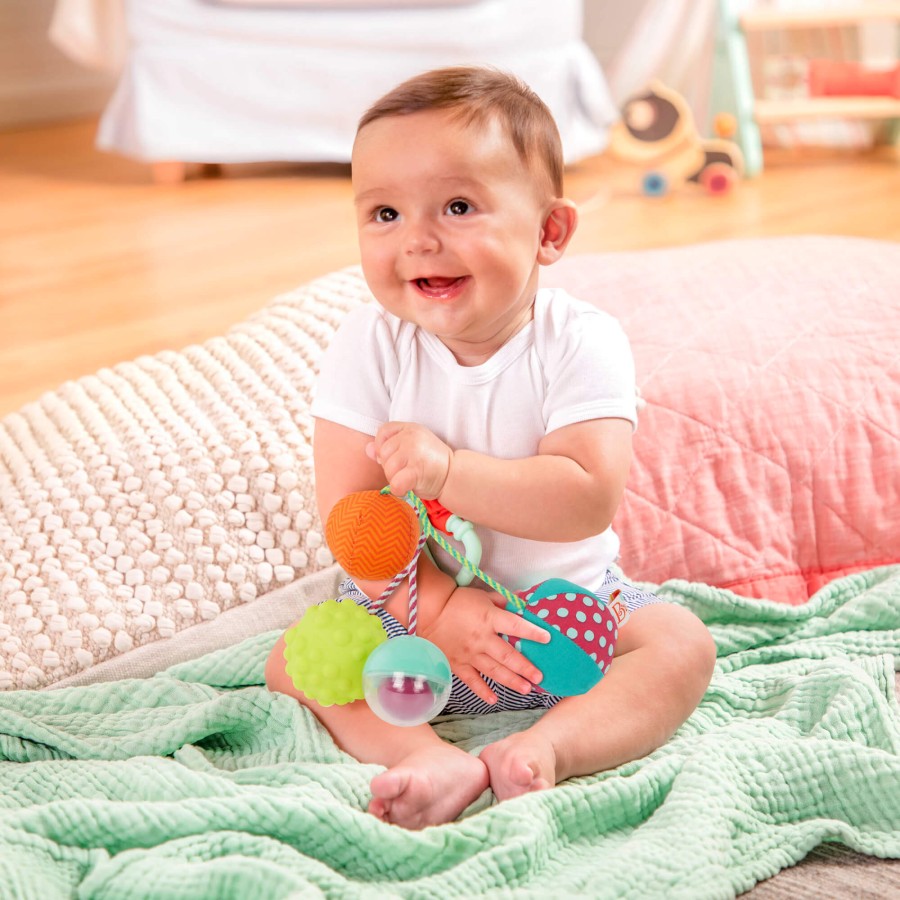 Sounds So Squeezy – gryzak z piłeczkami sensorycznymi / B.Toys