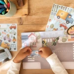 Książeczka z naklejkami Jim na ulicy / Little Dutch