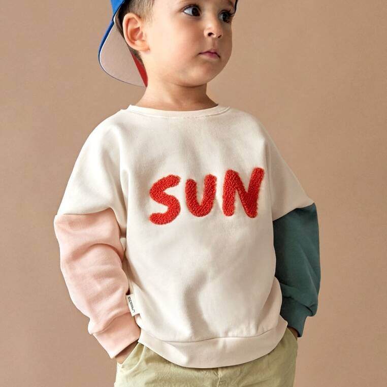 Bluza z bawełny organicznej GOTS Little Gang Sun milky / Lassig