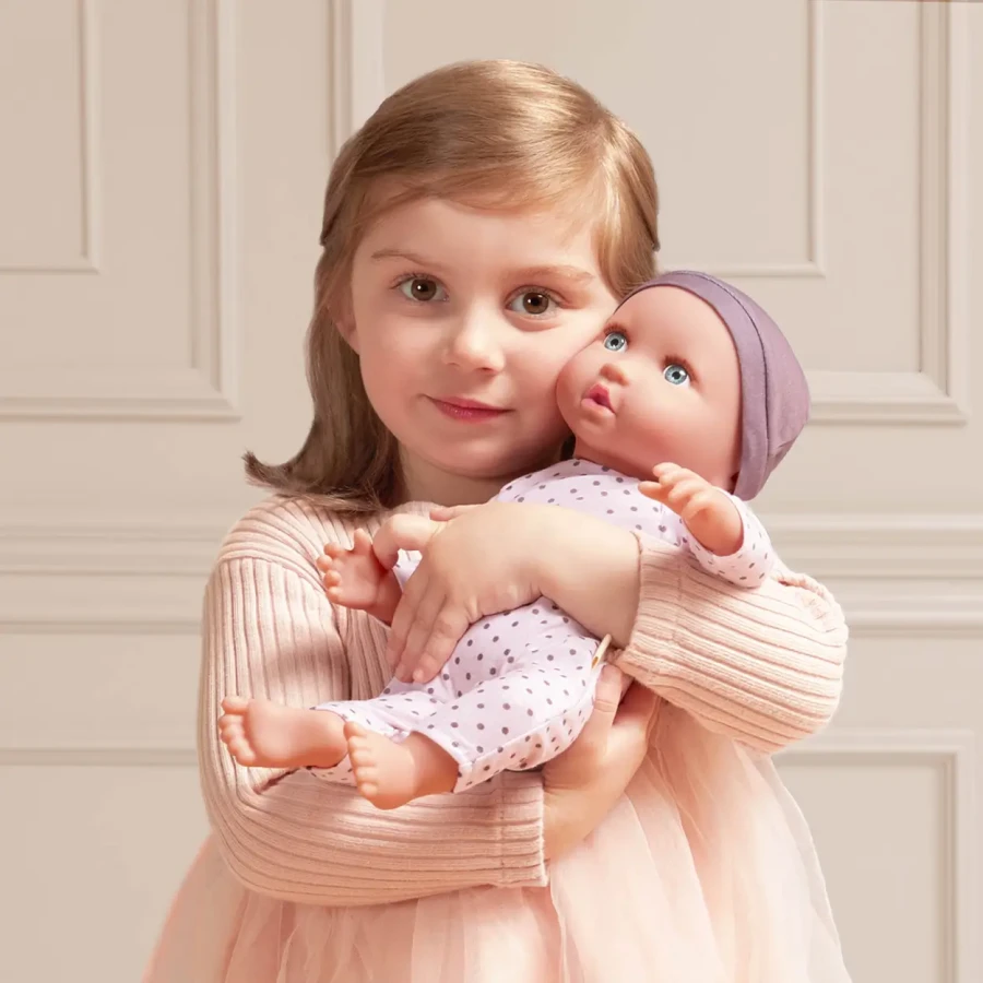 Lalka niemowlę ze smoczkiem, w piżamce w kropeczki i czapeczce / LullaBaby