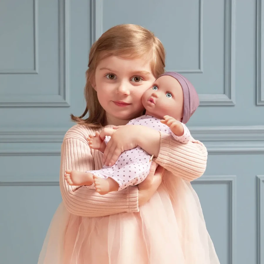 Lalka niemowlę ze smoczkiem, w piżamce w kropeczki i czapeczce / LullaBaby