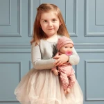 Lalka niemowlę ze smoczkiem, w piżamce w serduszka i czapeczce / LullaBaby