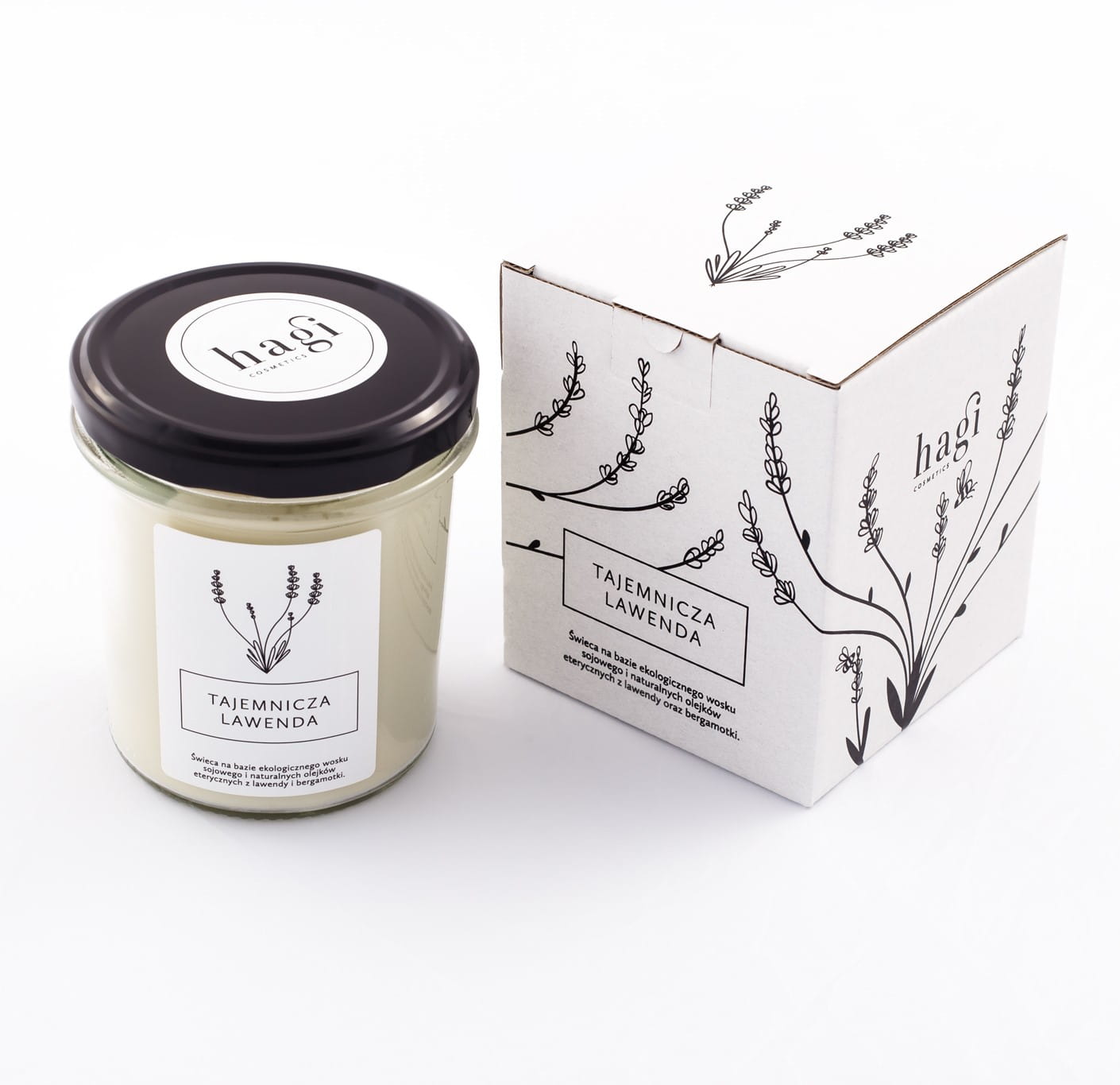 Świeca lawendowa w szkle a obok pudełko tekturowe